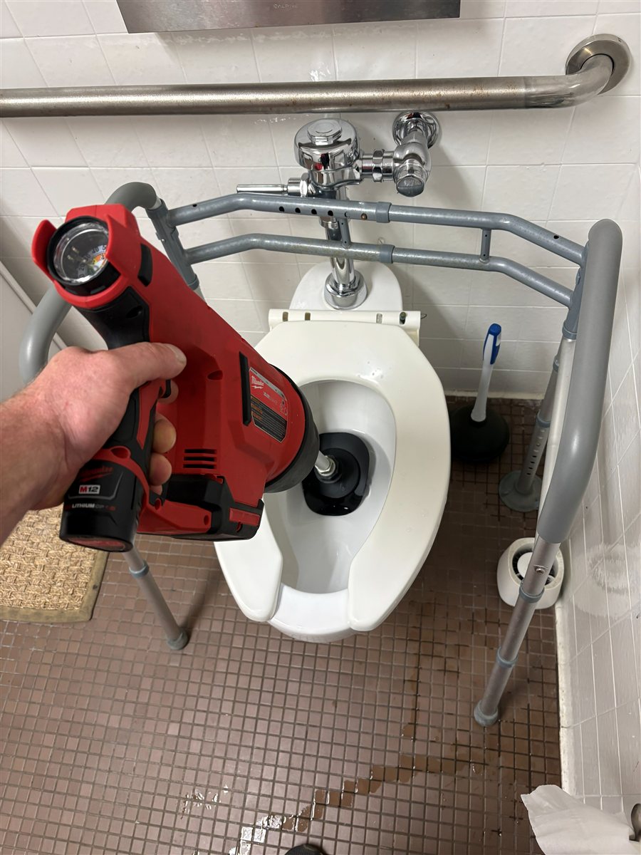 Commercial toilet drain cleaning.