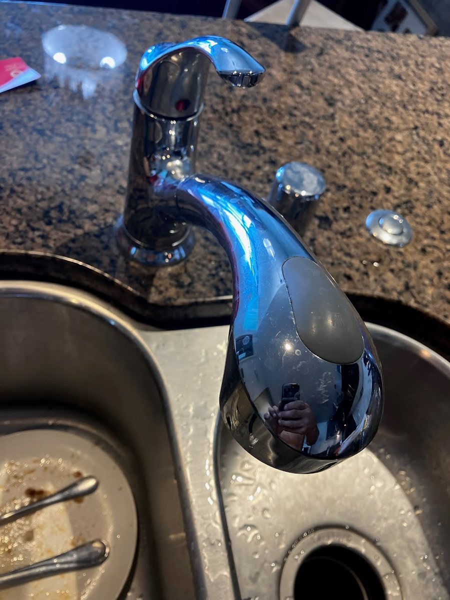 Kitchen pull out faucet with a failed spray head.