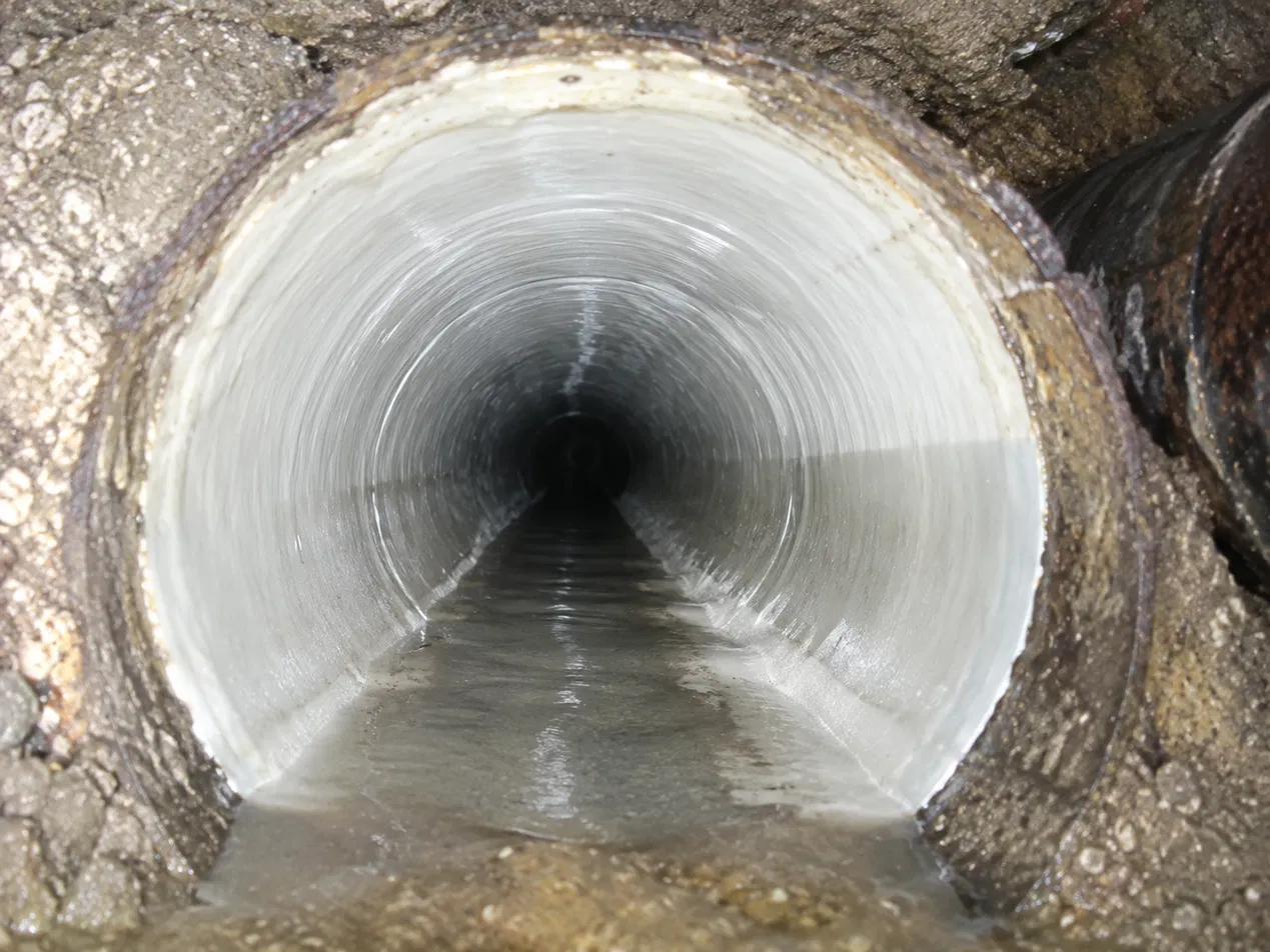 Pipe Lining, a new liner set inside the old host pipe.