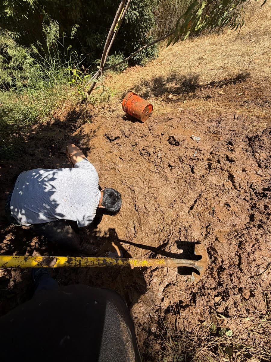 Excavating a leaking water service line.